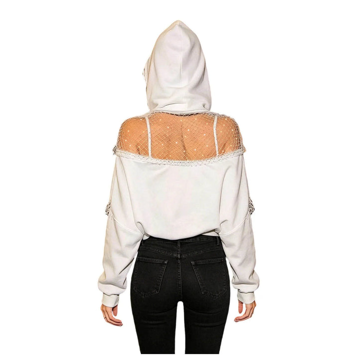 White cropped hoodie with fishnet shoulder panel, back view on mannequin-free model