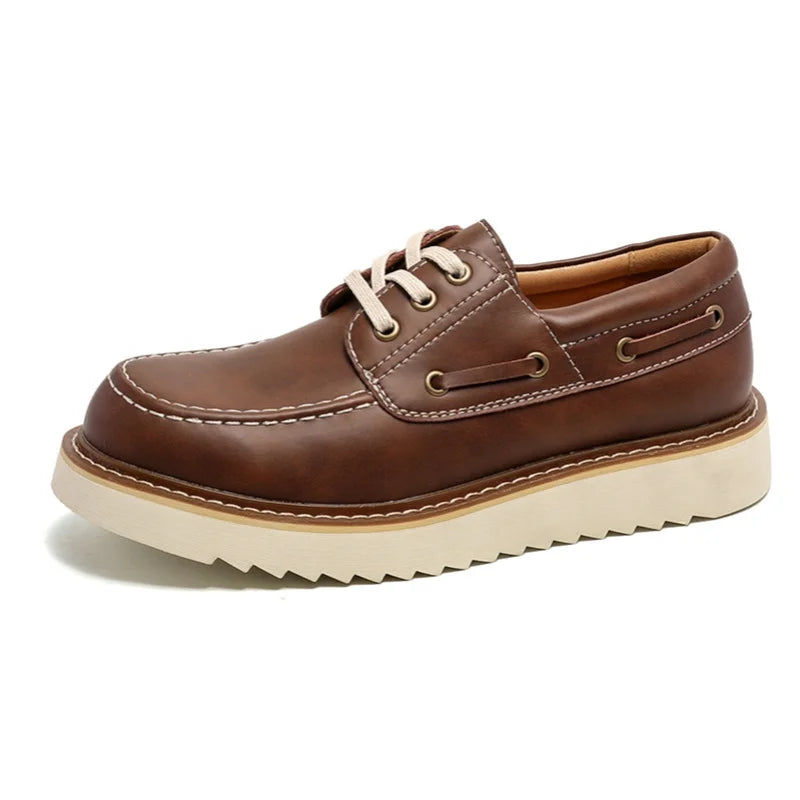 Brown leather boat shoe angled view on white background