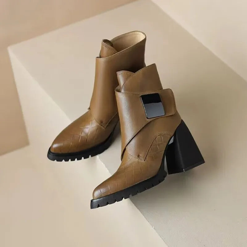 Khaki ankle boots pair on display surface