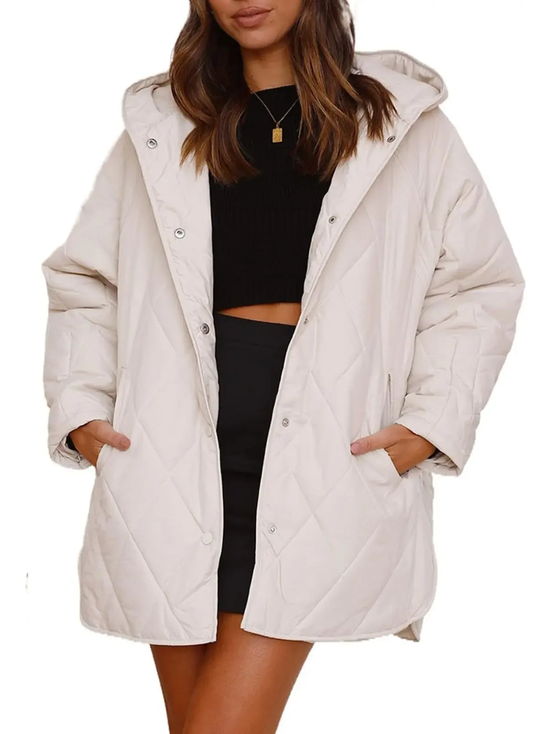 Woman wearing white diamond quilted hooded jacket with hands in pockets