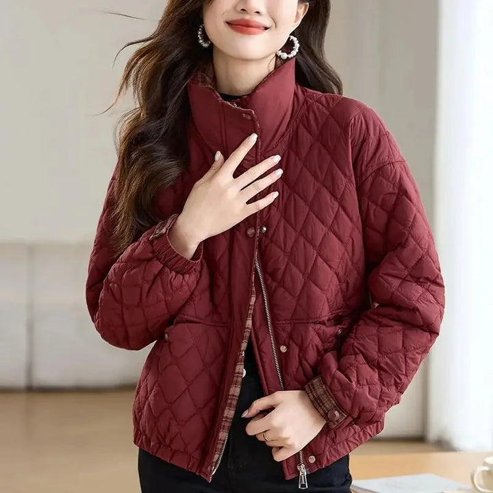 Close up of wine red quilted puffer jacket with stand collar