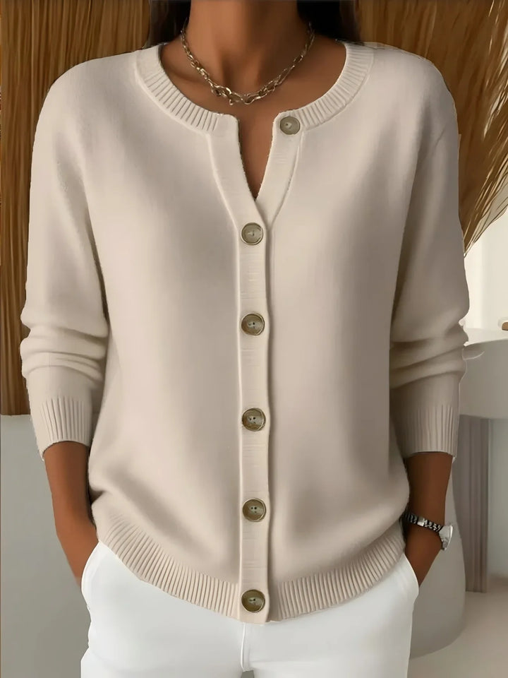 Apricot cardigan close-up view of neckline and buttons