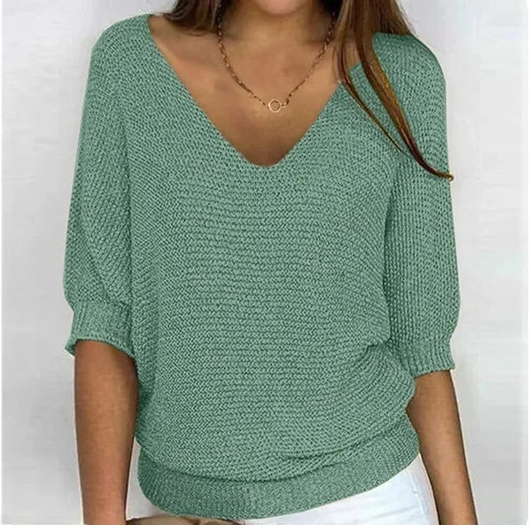 Light green V-neck knit sweater with three-quarter sleeves