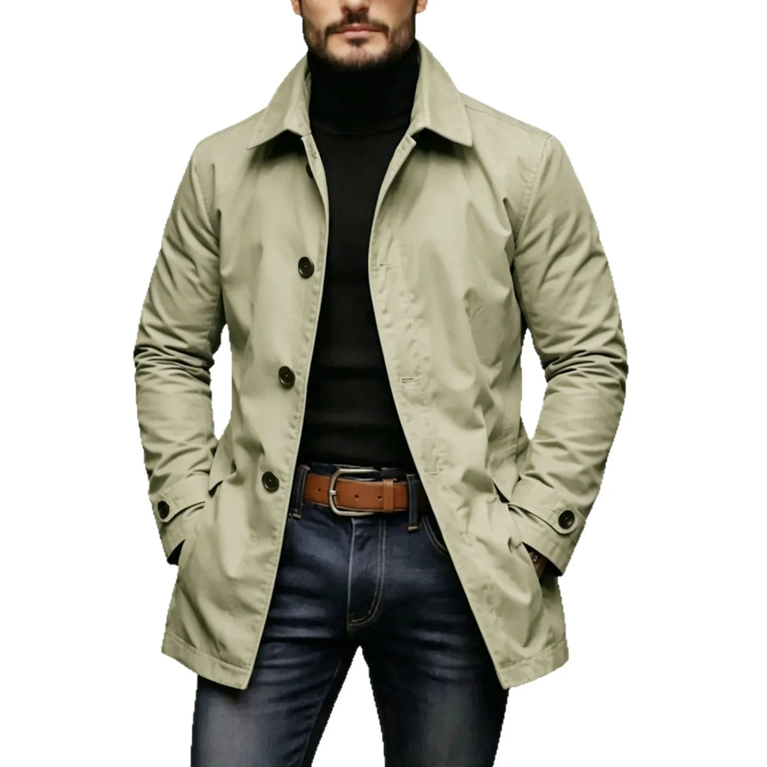 Man wearing khaki mac-style trench coat with button front placket