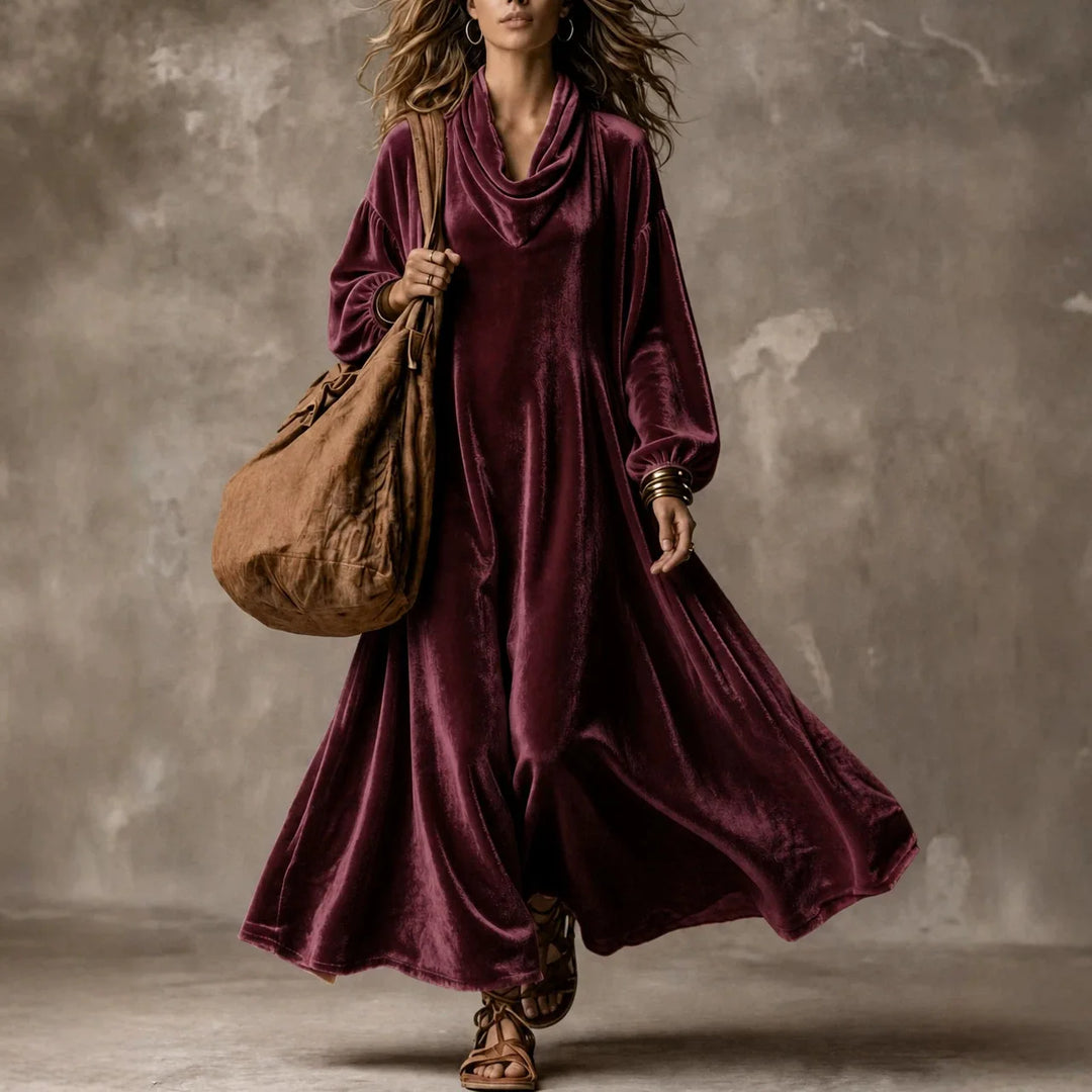Woman wearing wine red velvet cowl neck maxi dress