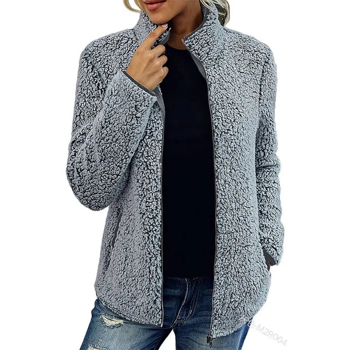 Woman wearing grey sherpa fleece zip jacket