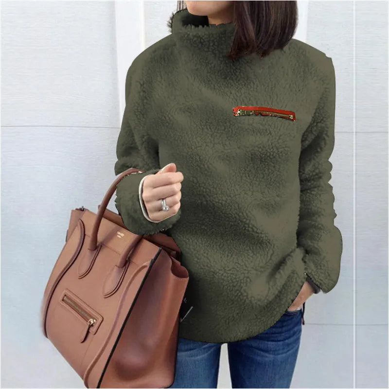 Woman wearing army green sherpa turtleneck pullover with zip chest pocket