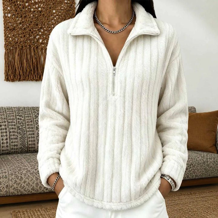 Woman wearing white ribbed quarter-zip pullover