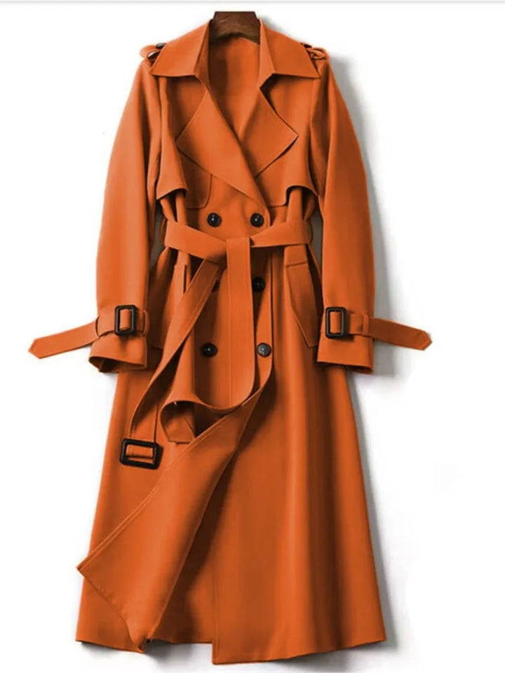 Orange belted double breasted trench coat on hanger