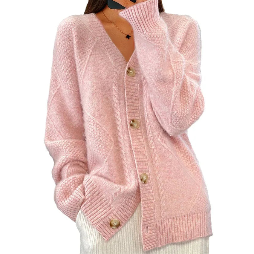 Woman wearing pink textured knit cardigan with button front