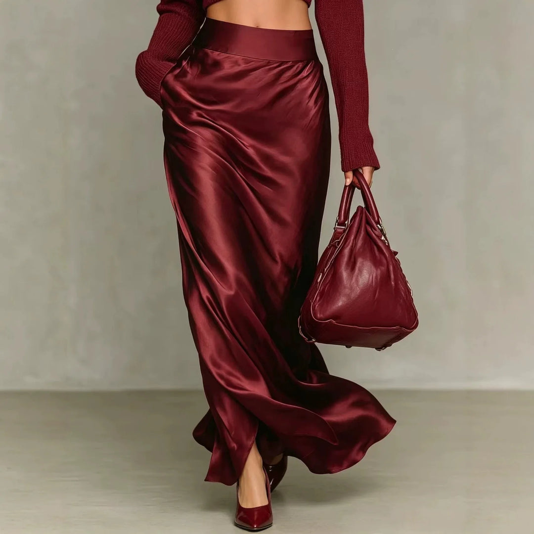 Burgundy satin maxi skirt with side slit, back view