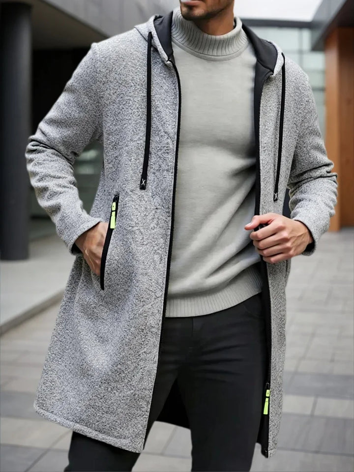 Man wearing light gray hooded mid-length fleece jacket unzipped