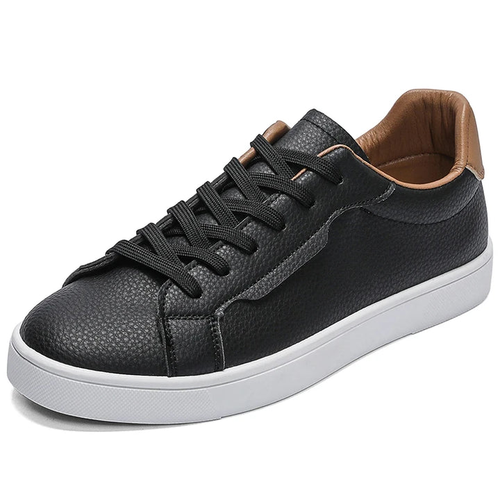 Black sneaker angled front view showing toe and lace detail