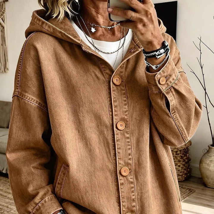 Close-up of camel brown hooded denim jacket with wood buttons