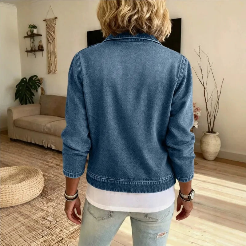Back view of blue denim zip front jacket