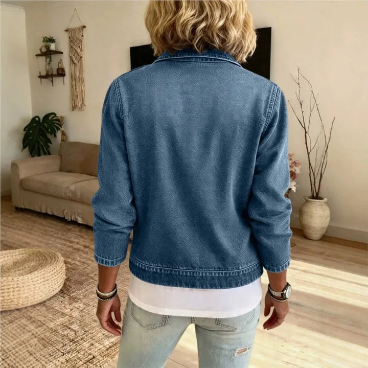 Back view of blue denim zip front jacket