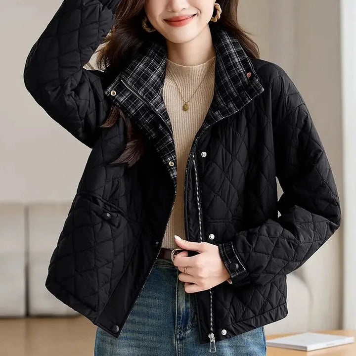 Woman wearing black quilted puffer jacket with plaid collar