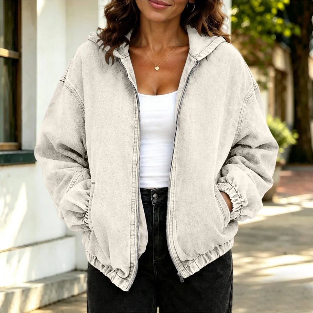 Woman wearing white oversized hooded denim jacket, front view