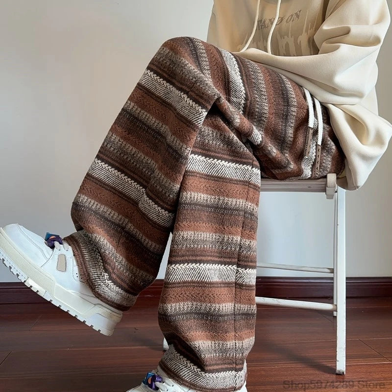 Close up of coffee striped wide leg pants seated showing drawstring and texture