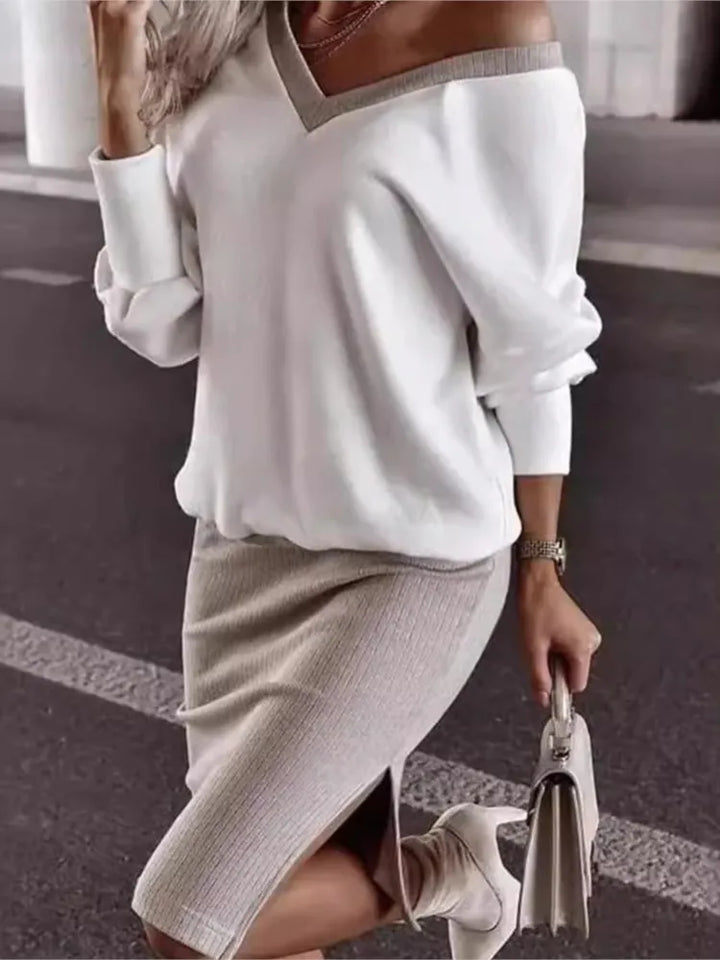 Woman wearing white off-shoulder sweatshirt and taupe ribbed pencil skirt set