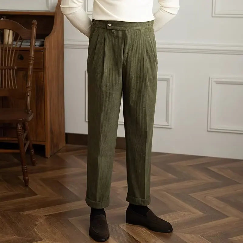 Man wearing green corduroy trousers with cuffed hem, front view