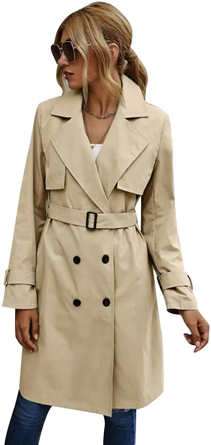 Woman wearing khaki trench coat with belt and sunglasses