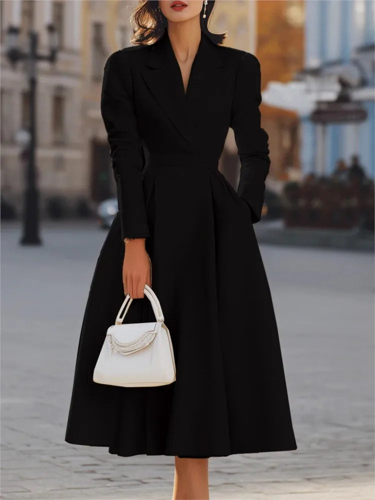 Black maxi dress with pleated skirt, close view