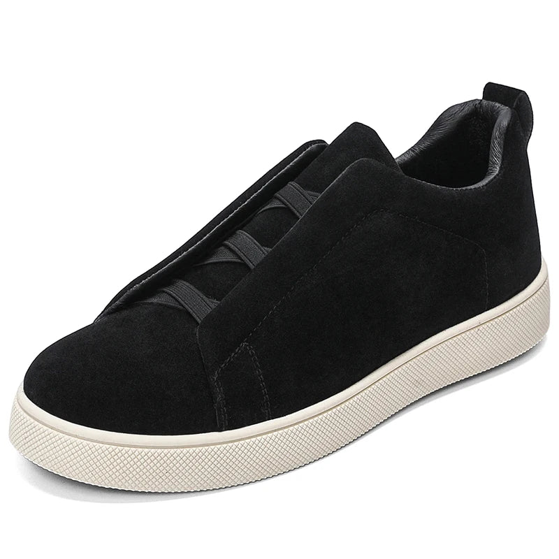 Black suede-look sneaker side angle view on white background