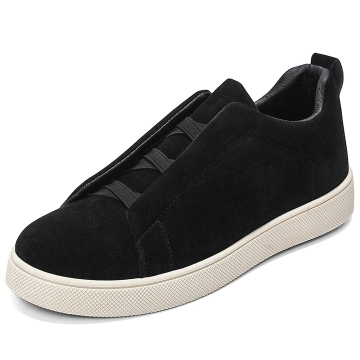 Black suede-look sneaker side angle view on white background