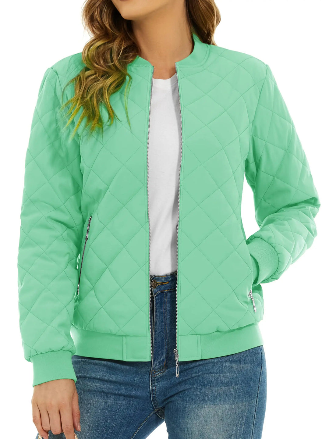 Close up of mint green quilted bomber jacket with zip pocket