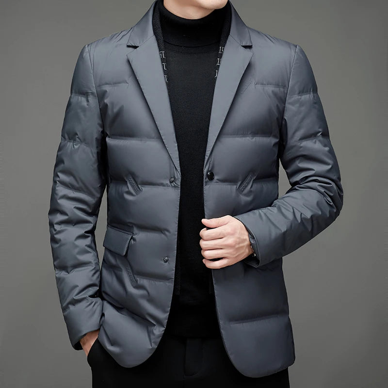 Close view of grey down blazer jacket with hand in pocket