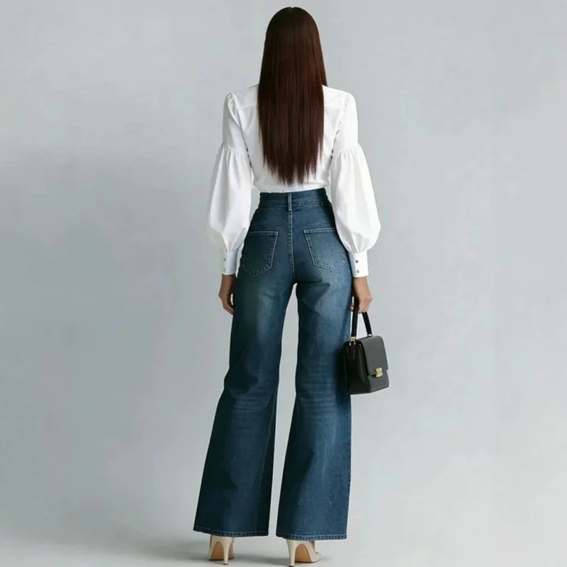 Back view of wide leg denim jeans showing patch pockets