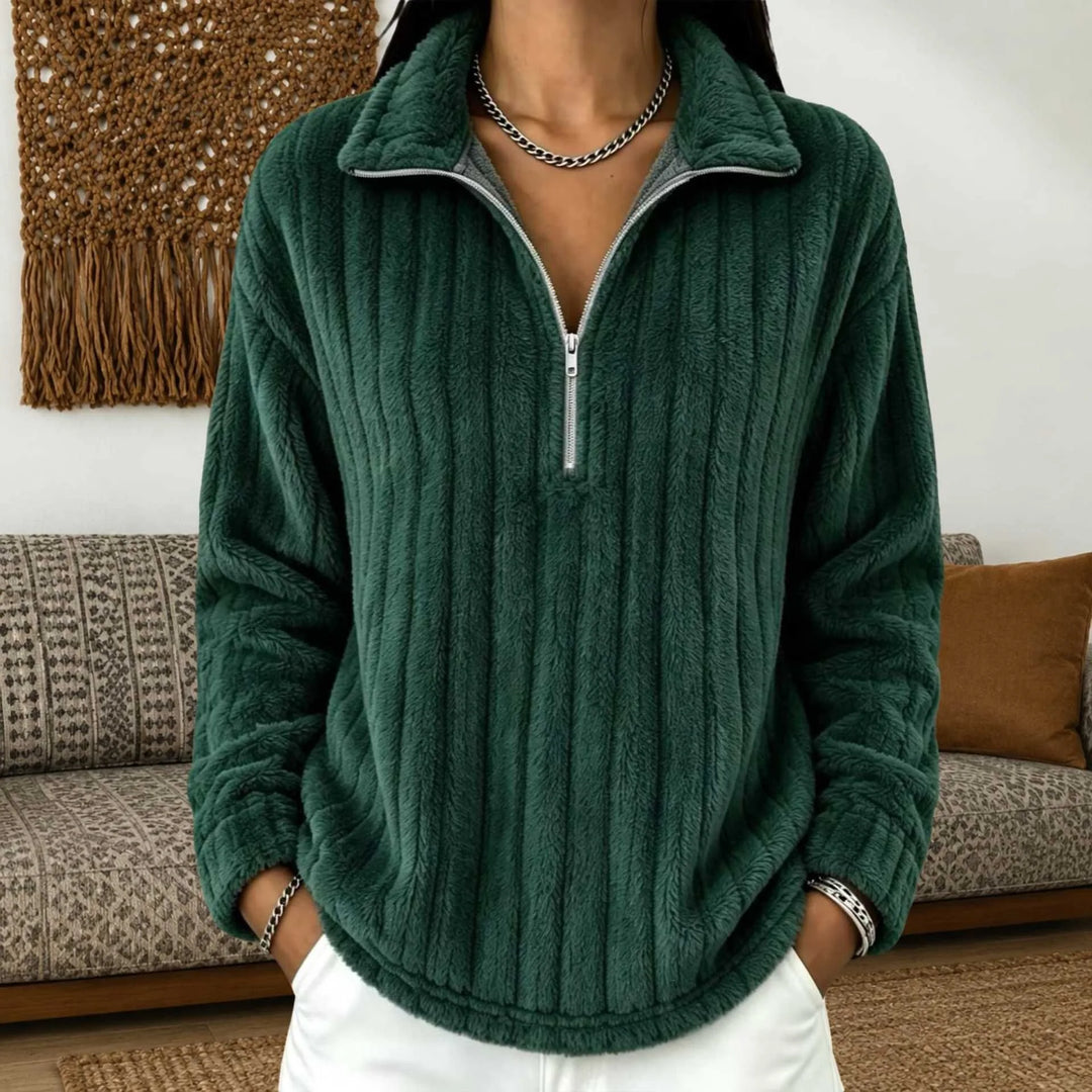 Woman wearing dark green ribbed quarter-zip pullover close up