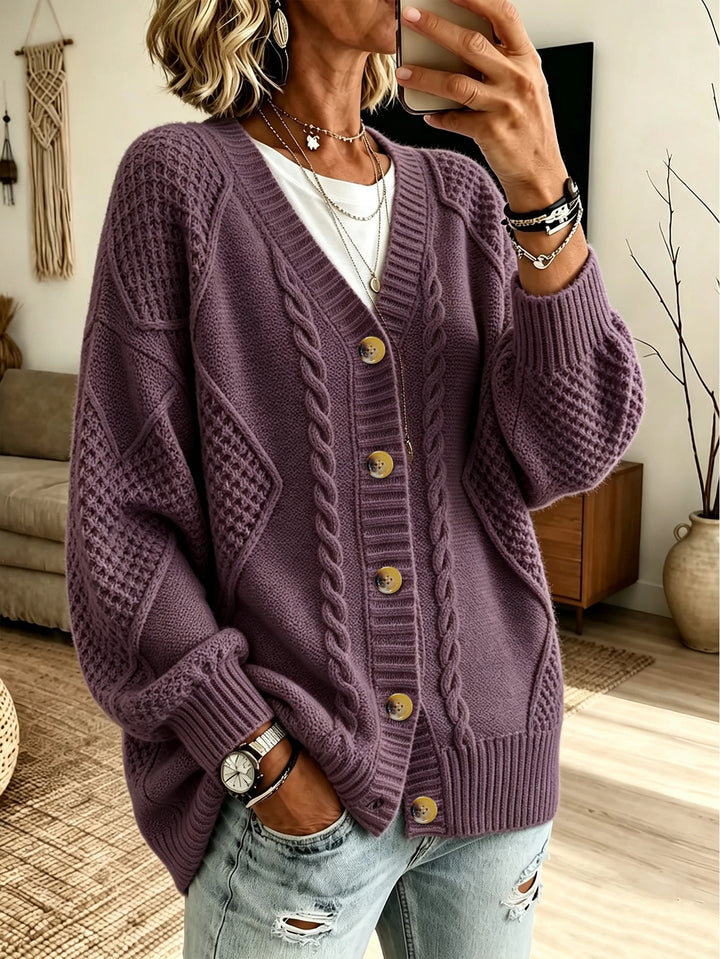 Woman wearing purple cable knit button front cardigan
