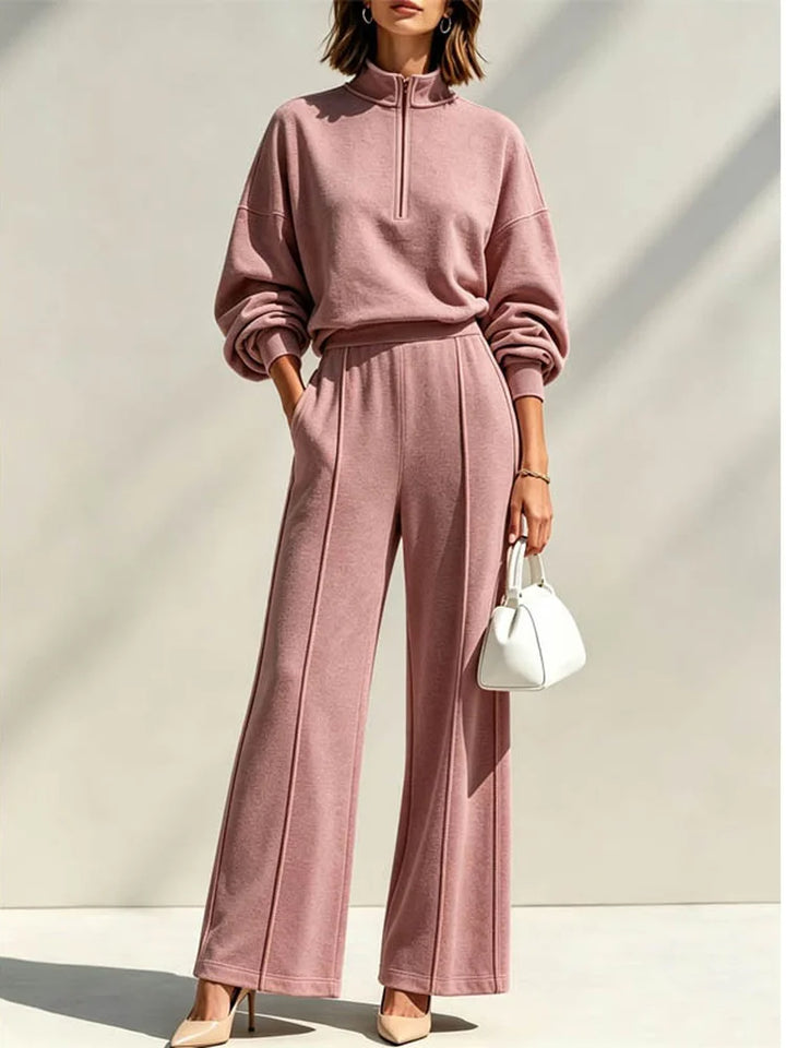 Woman wearing pink quarter zip pullover and wide leg pant set