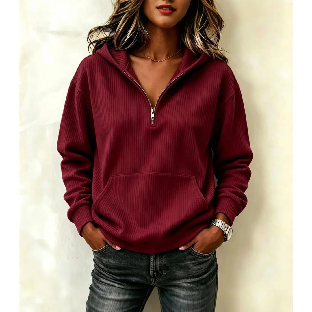 Woman wearing wine red ribbed half-zip hoodie with kangaroo pocket