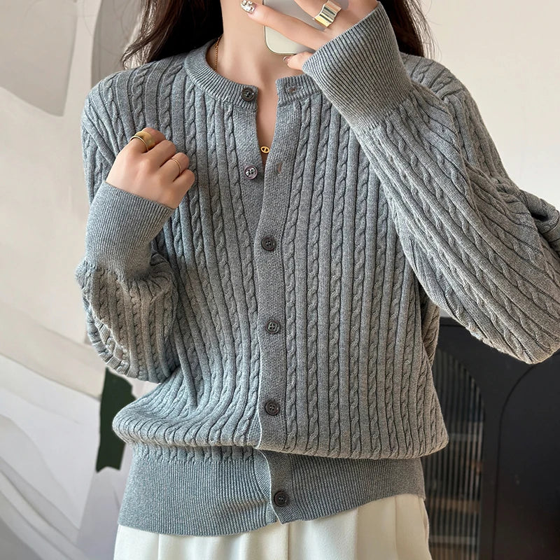 Grey cable knit cardigan close up buttons