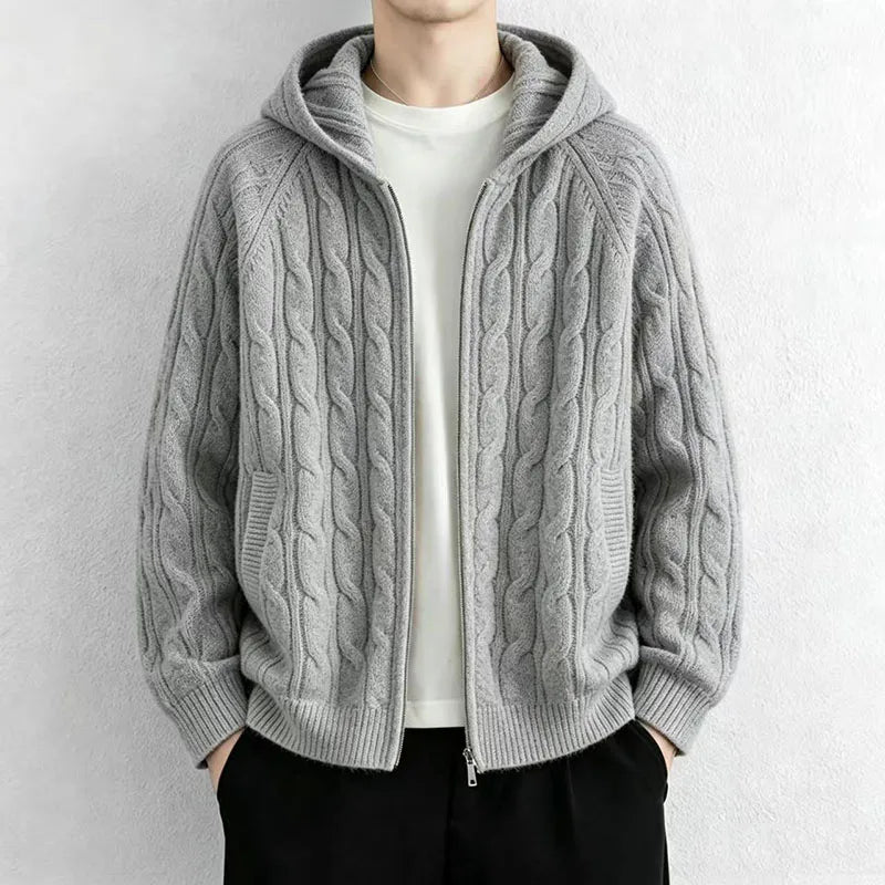 Man wearing light grey cable knit hooded cardigan with front zip