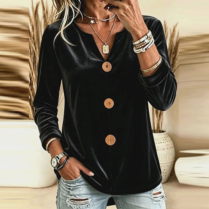 Black velvet V-neck blouse with wood-tone buttons, front view