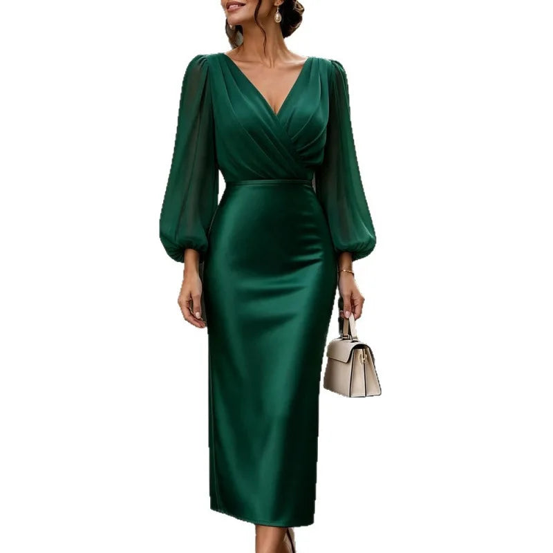 Woman wearing green wrap front satin midi dress with lantern sleeves
