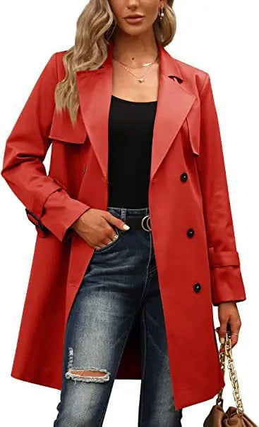 Woman wearing red trench coat with belt detail