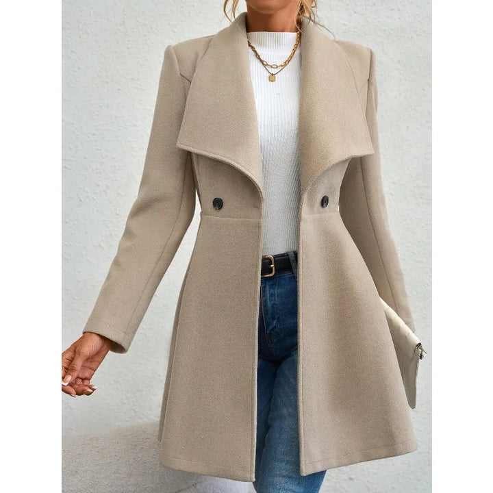 Woman wearing beige waterfall collar swing coat, side view