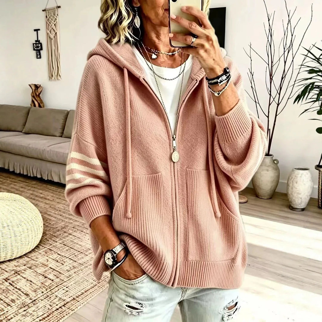Pink zip-up knit hoodie with striped sleeve panel and drawstring hood