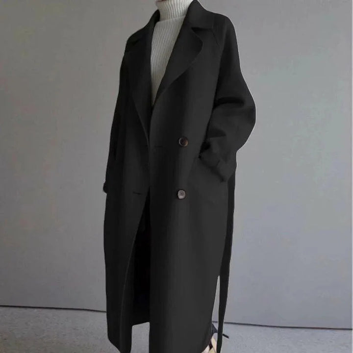 Black long wool-blend coat with notched lapel and tie waist