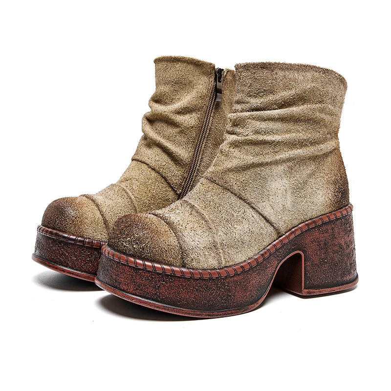 Pair of beige suede-look platform ankle boots angled view