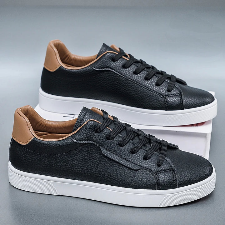 Black leather-look low-top sneakers with contrast heel tab, side view