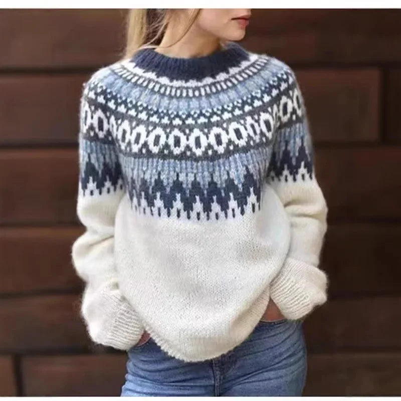 Woman wearing white fair isle sweater with blue yoke pattern