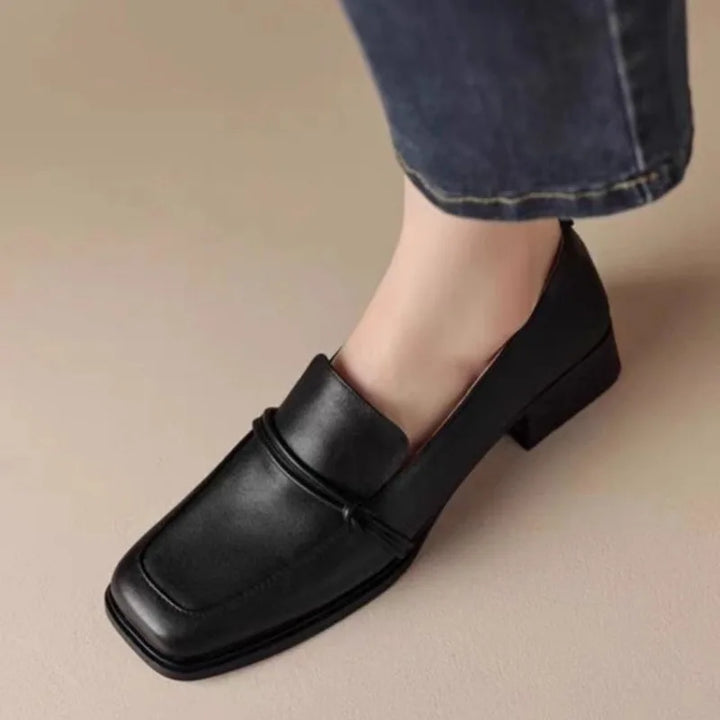 Black square toe loafer worn with jeans