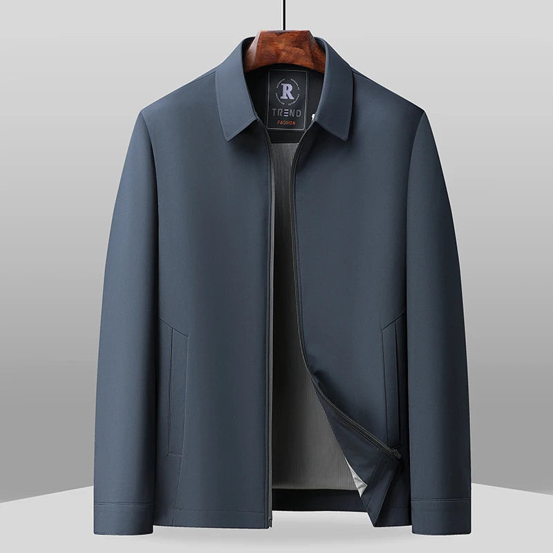 Navy blue zip-front jacket on hanger, open front detail