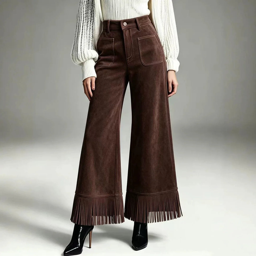 Woman wearing dark brown suede-look flare pants with fringe hem, front view